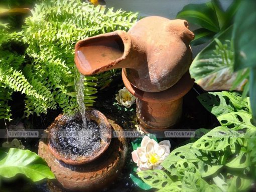 Bình gốm phun nước trang trí sân vườn